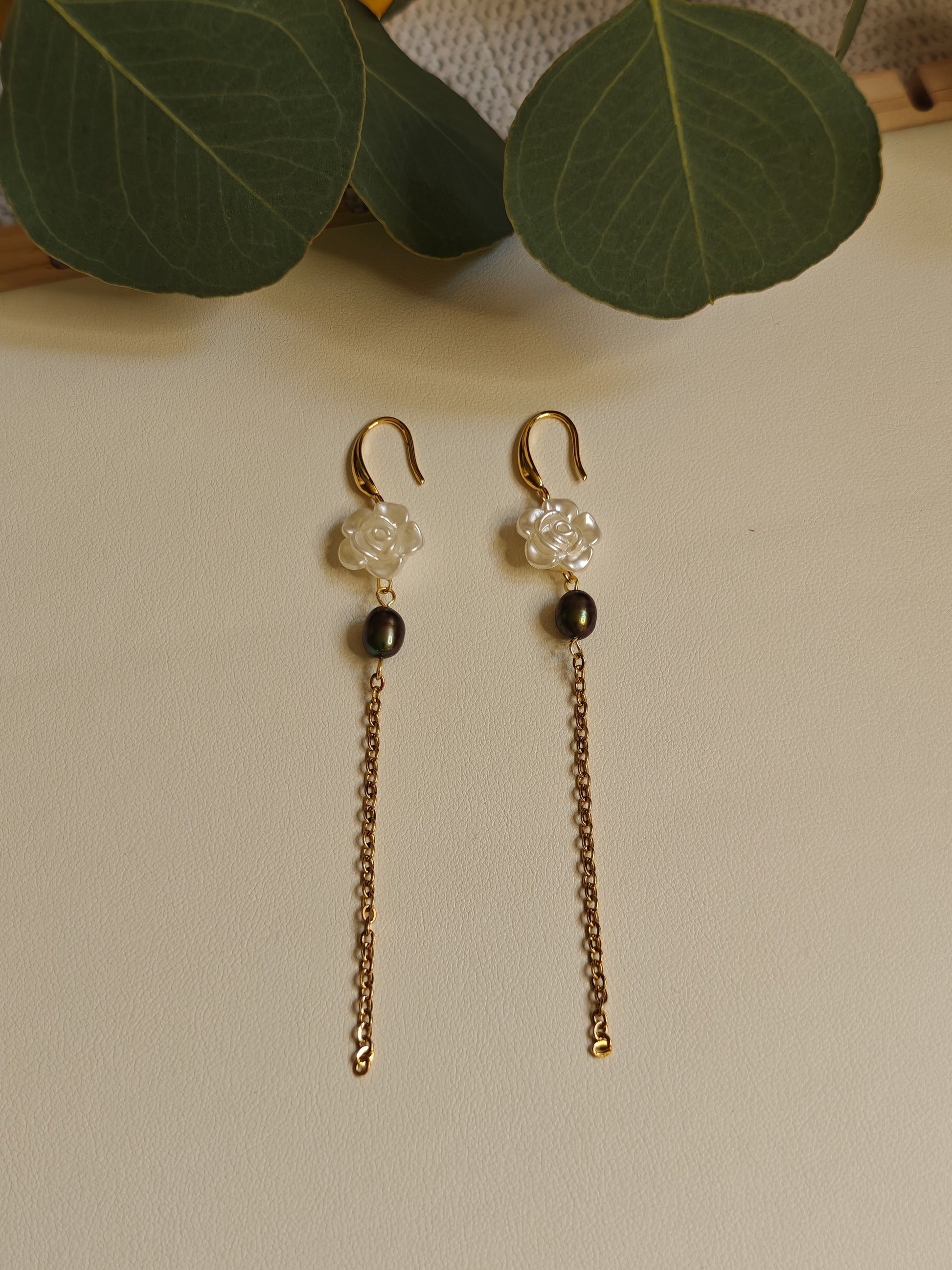 Image of the earrings laying flat on a white surface 